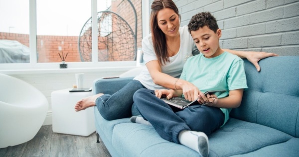 Mother and son spending time in their conservatory 2