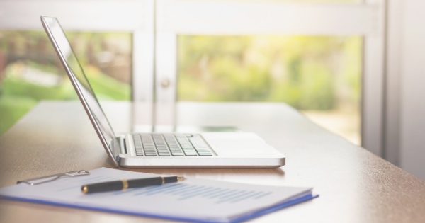 Laptop on desk in home office after converting conservatory 2