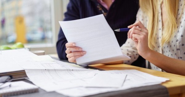 Couple figuring out if they are able to invest in conservatory roofing