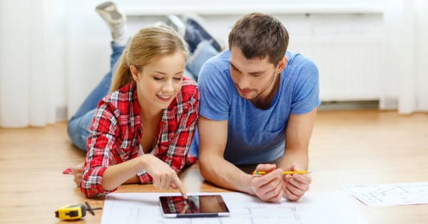 Happy couple planning a conservatory roof conversion 2