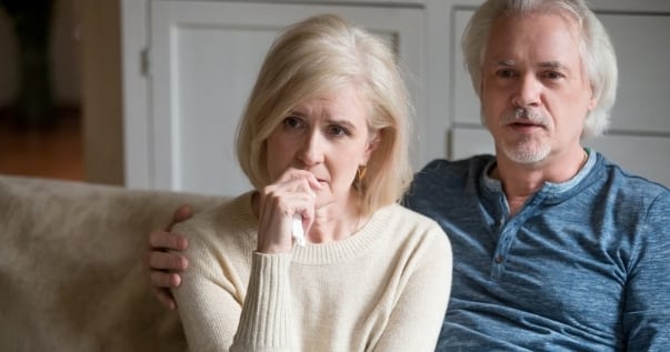 Worried couple because their polycarbonate conservatory roof is falling apart and they need to find a trusted solid roof conservatory installer.