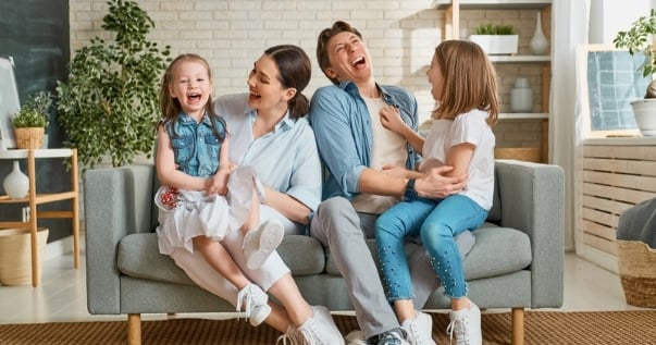 Family enjoying their vacation at home after a conservatory roof conversion.