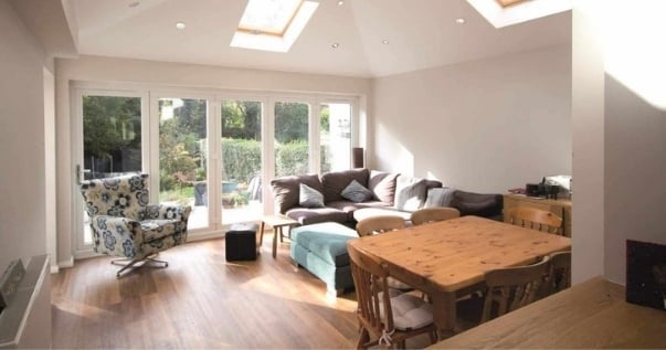 Family undergoes a conservatory conversion and joins their dining room and living room.