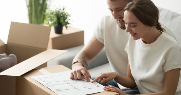 Couple deciding whether to do a home extension or choose a conservatory.