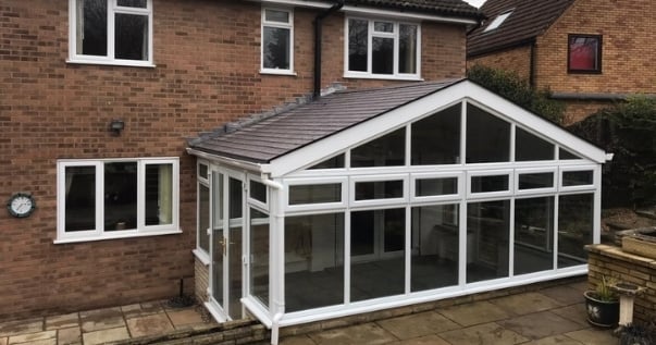 Family excited about their conservatory conversion with a Guardian Warm Roof.