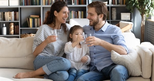 Family happily celebrating their conservatory conversion because it was ready in a week.