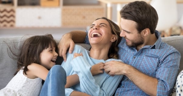 Happy family enjoying their new conservatory transformation all year round.