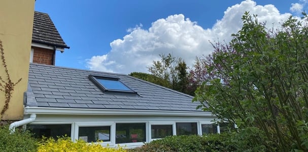 Fantastic solid conservatory roof installed by Projects4Roofing, sorrounded by plants