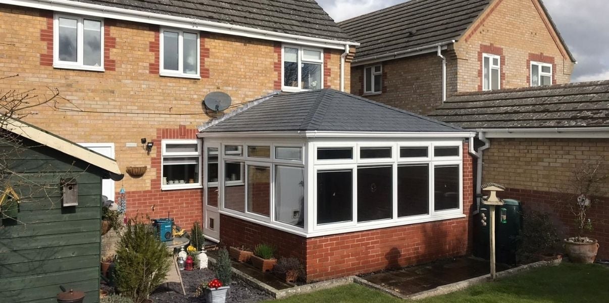 Neat dark tiled conservatory roof installed by P4R