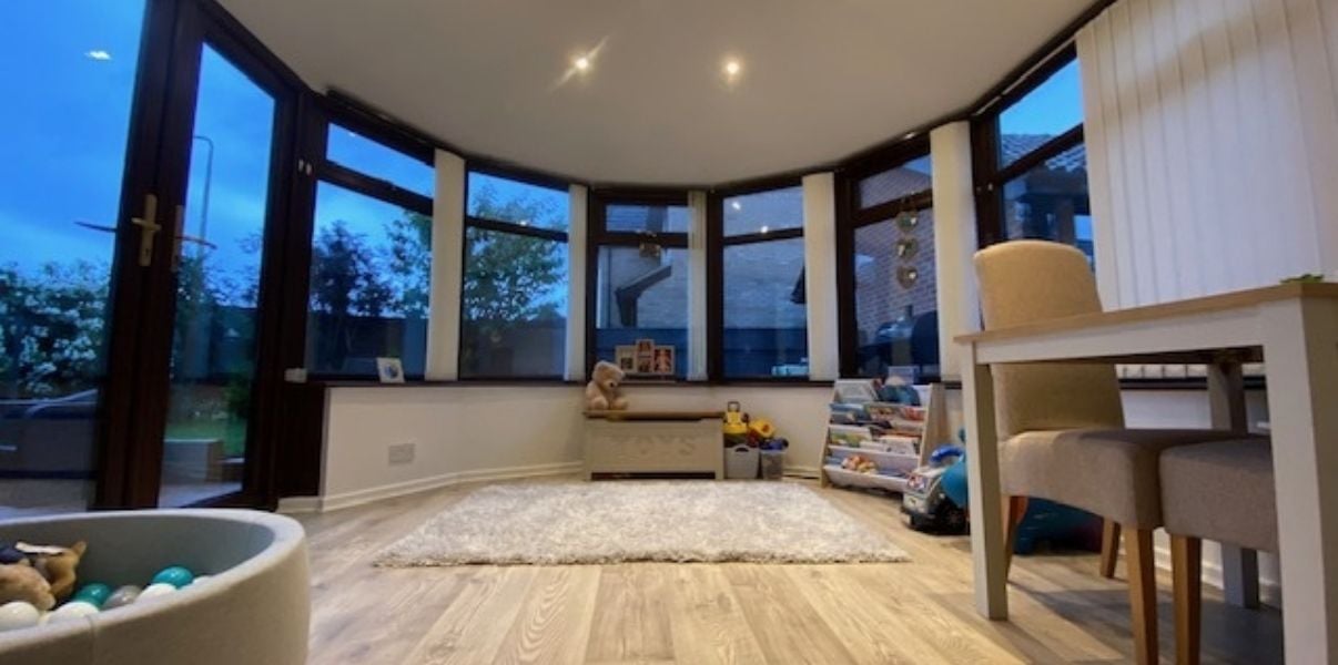 Cozy kids playroom built under a solid roof conservatory