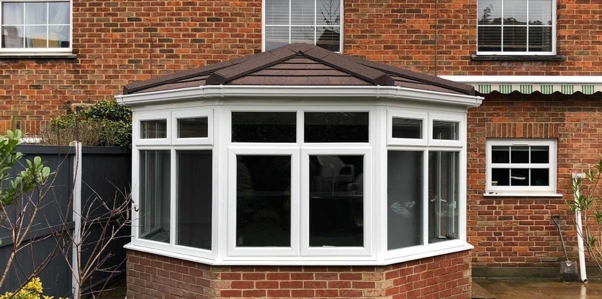 Quaint brown tiled conservatory transformed by Projects4Roofing