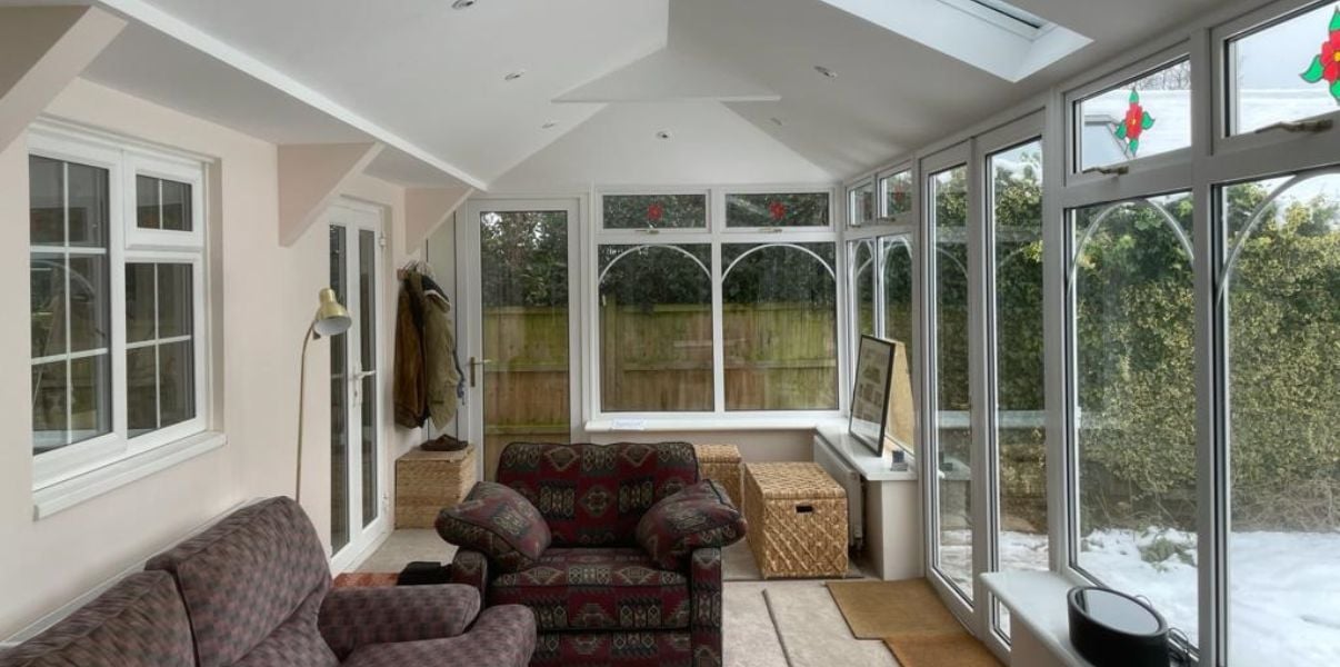 Warm insulated conservatory with a solid roof on a winter day