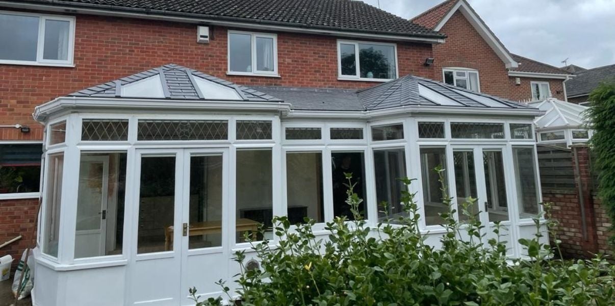 Lovely conservatory roof with a VELUX window