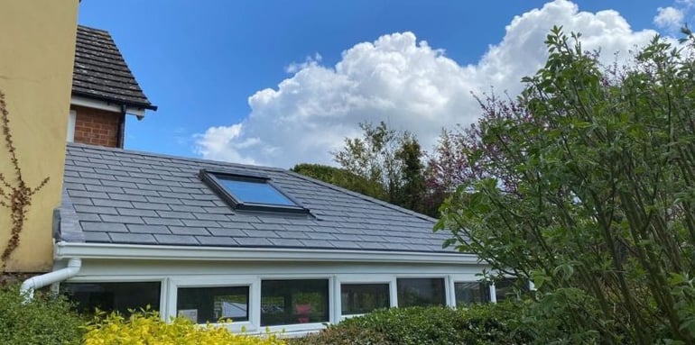 Charming-solid-roof-conservatory-with-a-window-on-a-cloudy-day