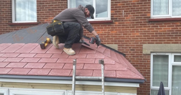 Family hires a qualified roofer to replace their polycarbonate conservatory roof to a guardian warm roof after having a leaking conservatory roof