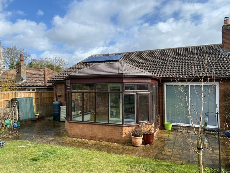 The Pickerill family's conservatory, after Projects4Roofing installed their solid conservatory roof