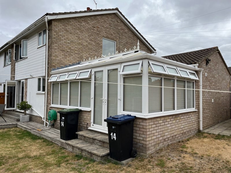 Spencer conservatory with a plycarbonate roof, before being transformed by Projects4Roofing