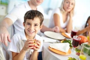 Kid enjoying breakfast in his new Conservatory during summer