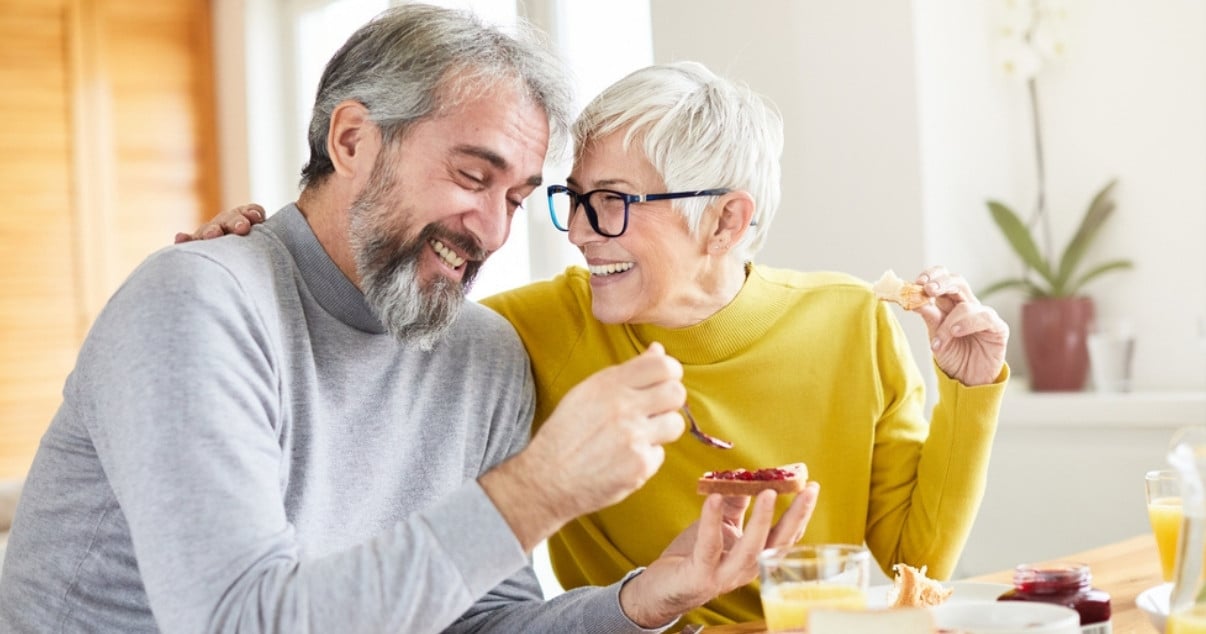 Senior couple having breakfast in their Conservatory after having a Conservatory conversion