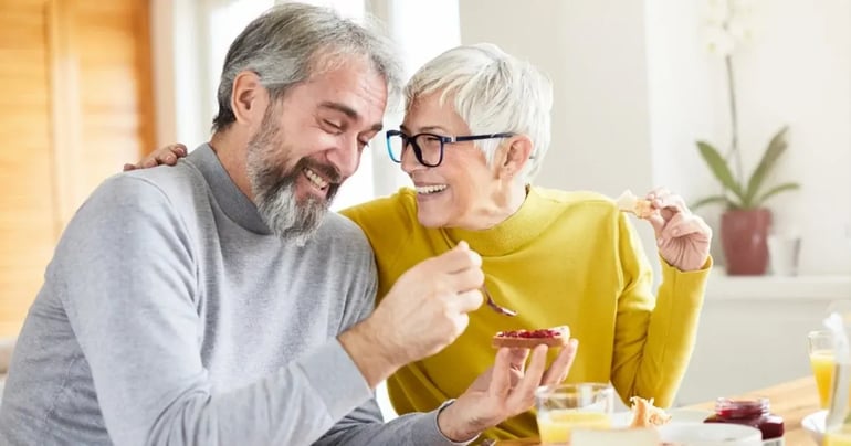 Senior couple having breakfast in their Conservatory after having a Conservatory conversion