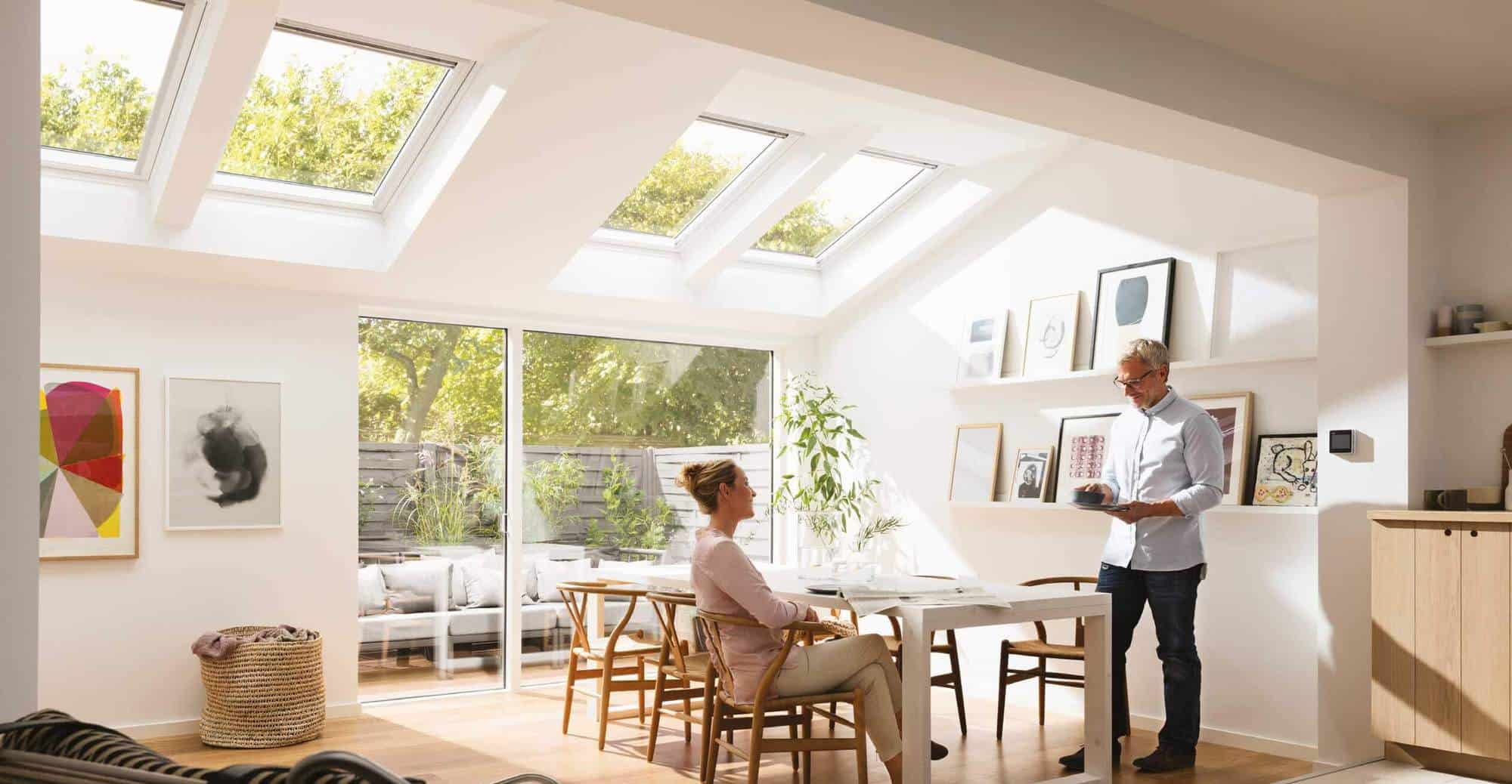 Couple enjoying their conservatory after having a conservatory roof conversion