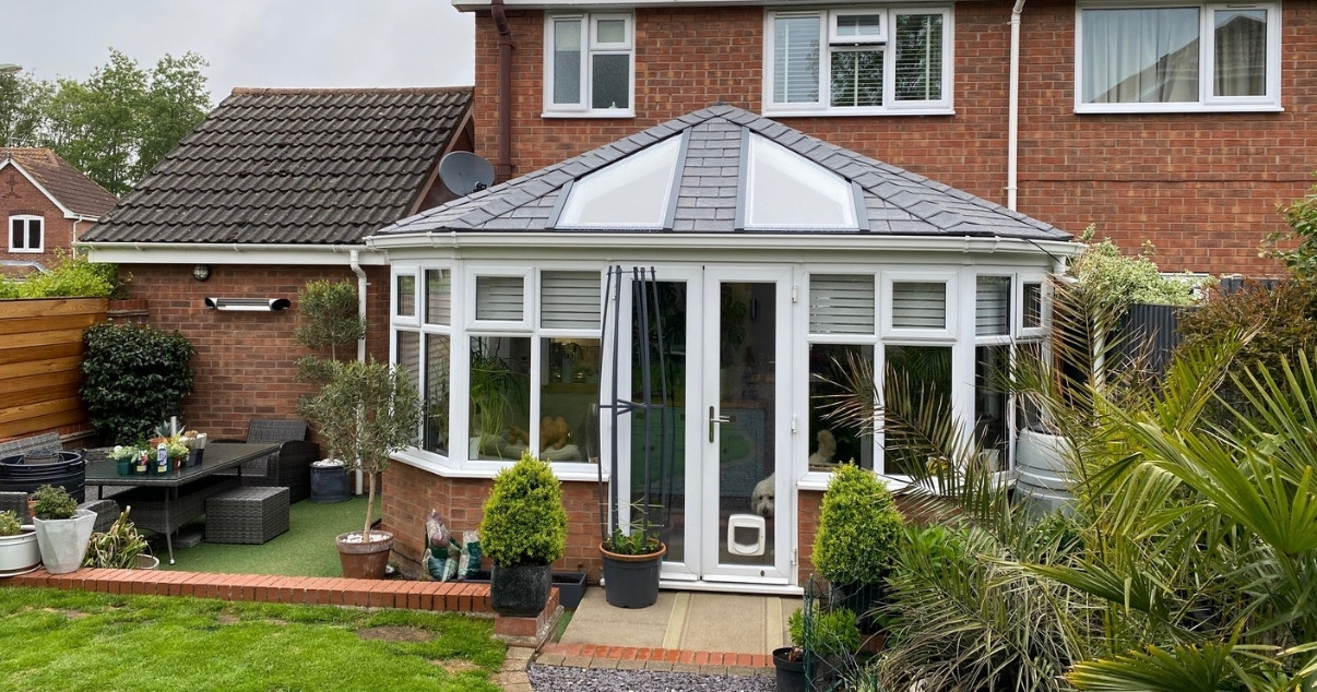 Family is ready to enjoy their Conservatory with a Guardian Warm Roof